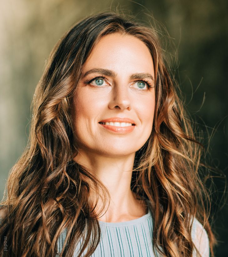 woman with bright blue eyes looking up
