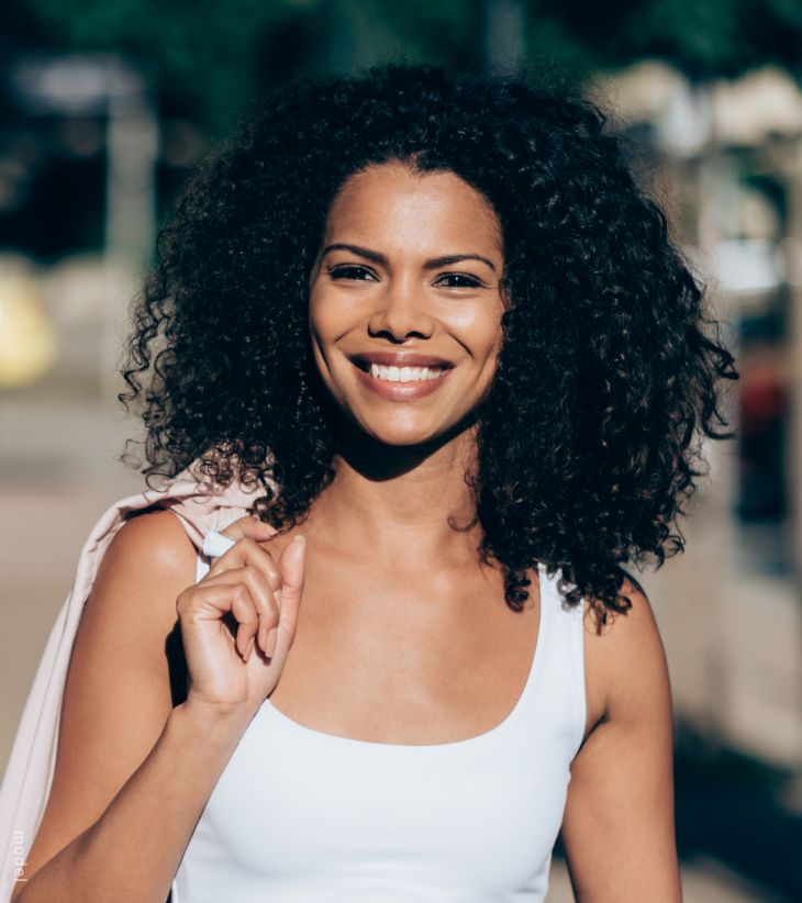 black woman walking down a street